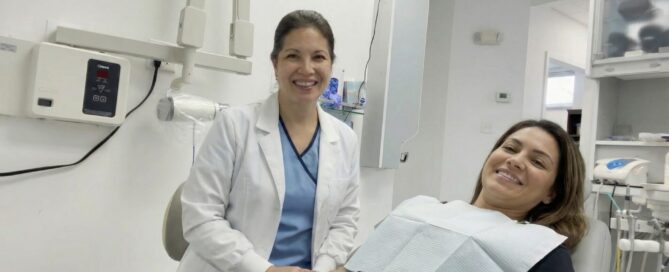 Dentist and patient smile after bonding chipped teeth in Alexandria VA