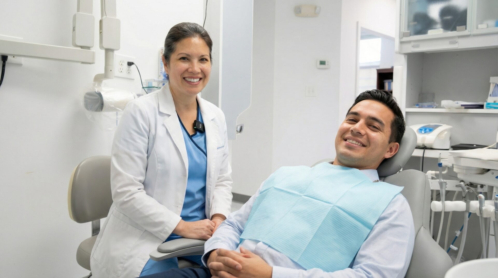 Smiling patient at dentist office in Woodbridge VA learning about porcelain veneers cost breakdown