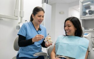 Smiling patient consulting dentist about affordable veneers options in Woodbridge VA
